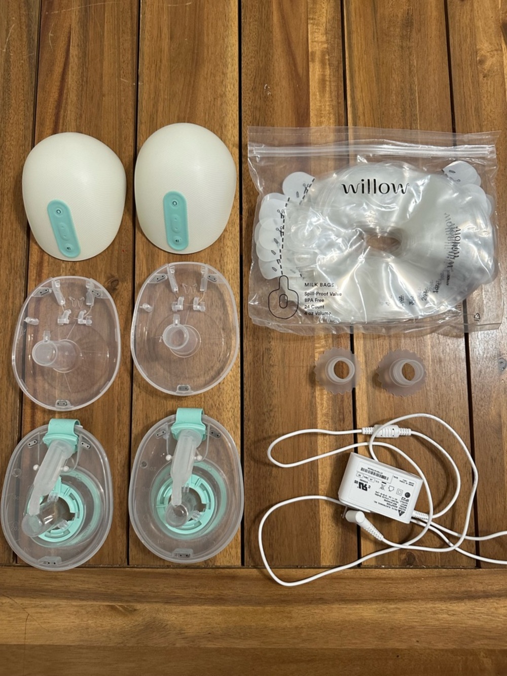 Willow 360 Wearable Breast Pump in Mint with reusable milk containers